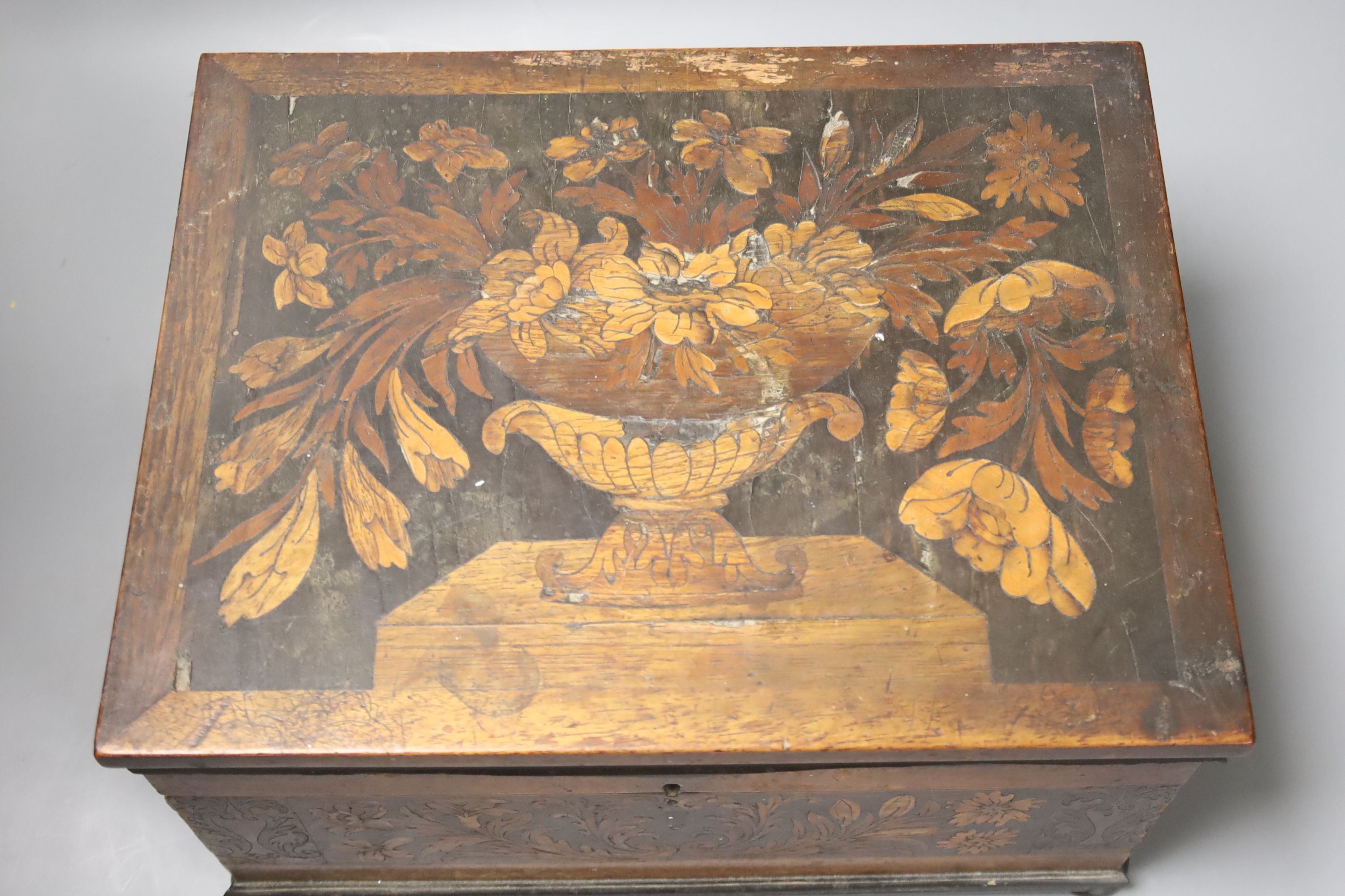 An unusual George IV ebony and marquetry inlaid tea caddy, 32cm